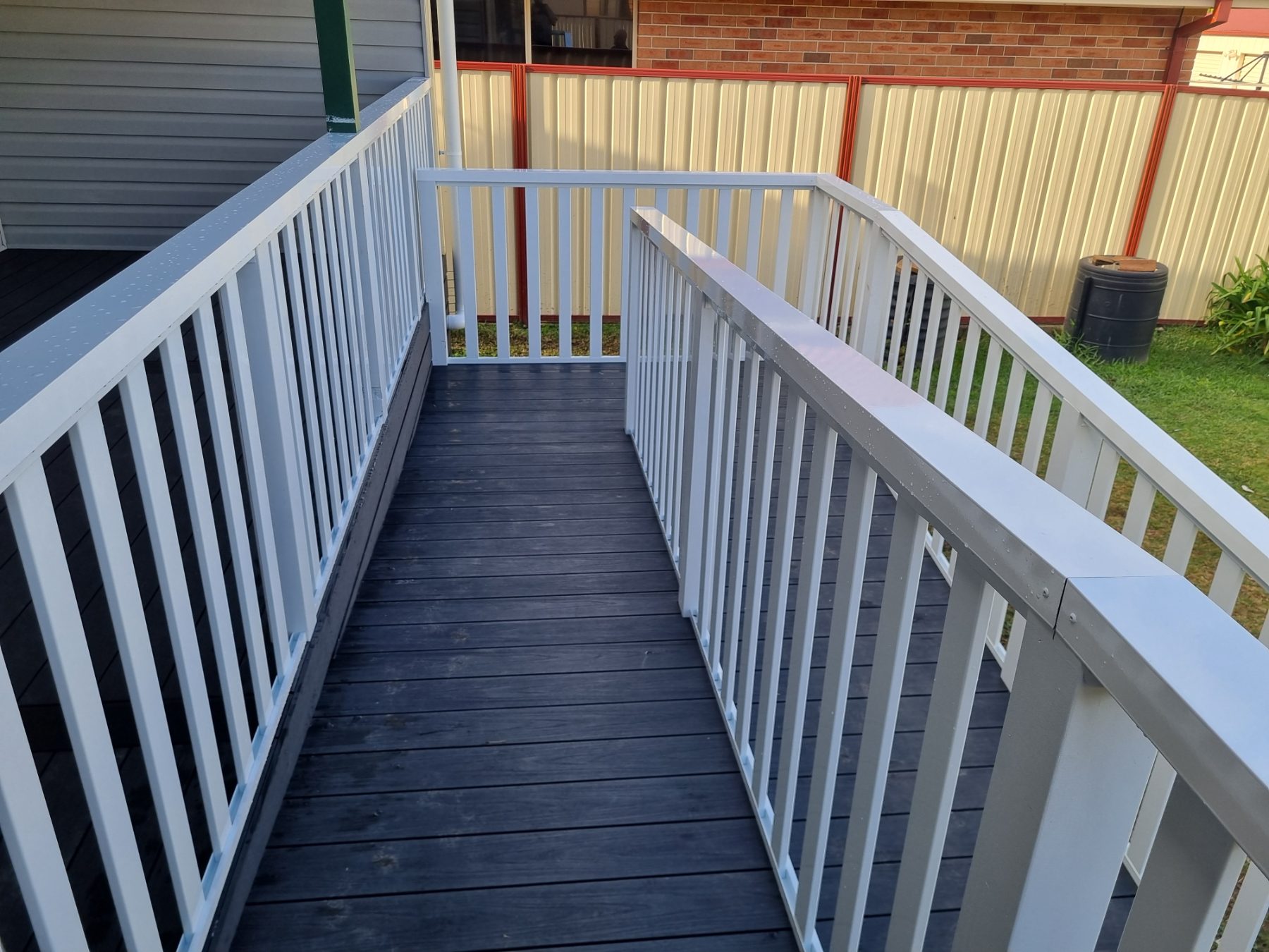 Composite deck and ramp with white balustrade, Illawarra